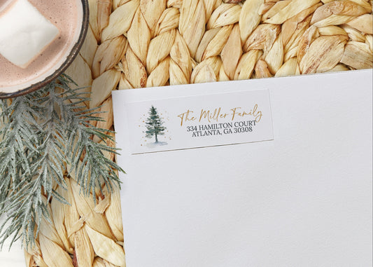 White envelope with personalized address on a woven mat with a hot chocolate and marshmallow in the background