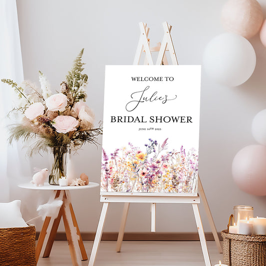 Bridal shower setup with balloons, flowers, and a welcome sign.
