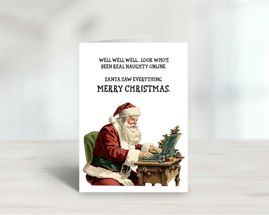 Card with Santa Claus using a laptop, text about being naughty online, on a white background